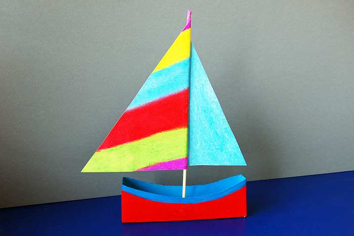 DIY sailboat made from recycled box materials for kids craft