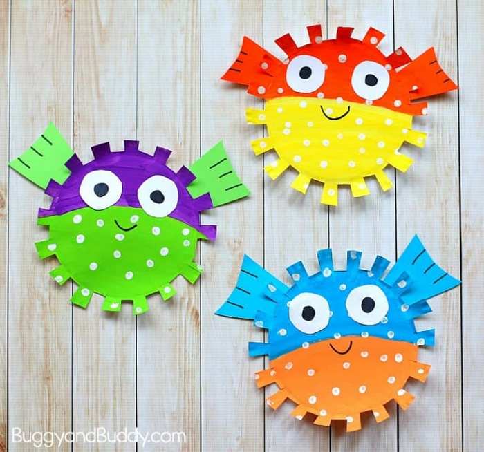 Paper plate pufferfish craft painted and decorated for kids activity