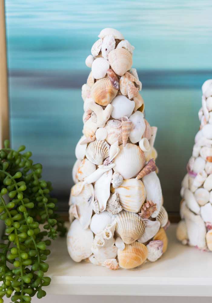 DIY seashell decor cones displayed on a table