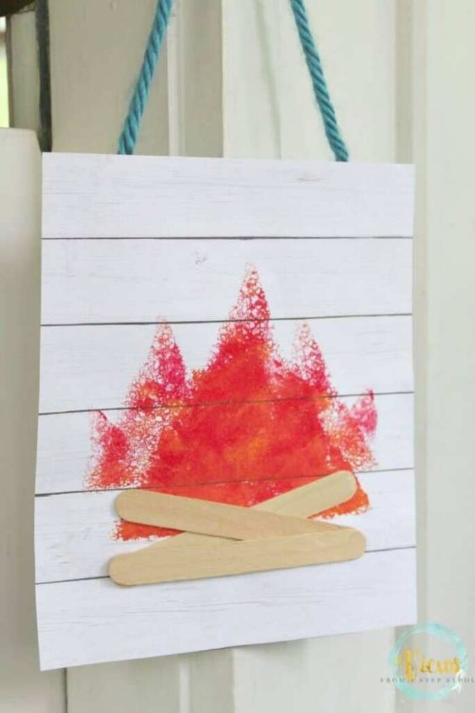 Sponge stamped camping art with campfire design