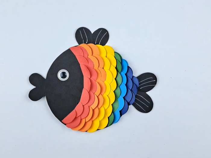 Rainbow fish paper craft with colorful shiny scales for kids