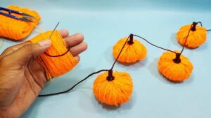 The Easiest Method to DIY Pumpkin Fall Garland + No-Knit Pumpkin Guide