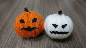 DIY Spooky Orange and White Yarn Pumpkins for Halloween